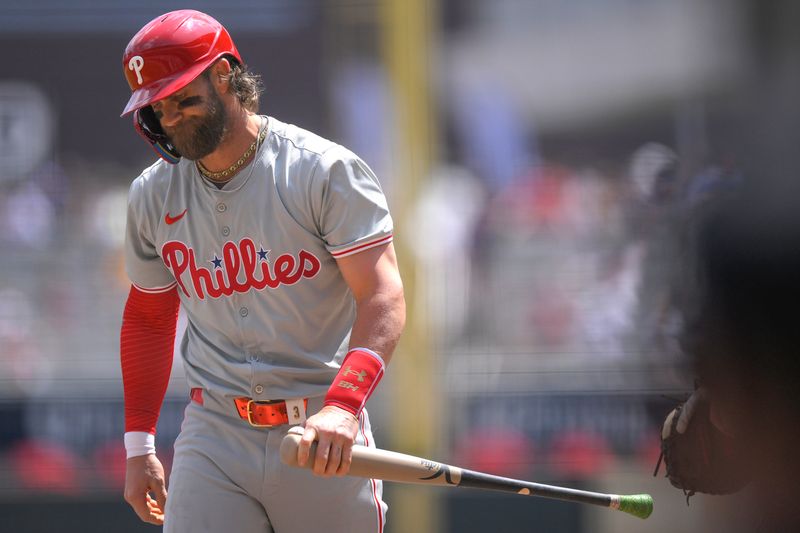 Jul 24, 2024; Minneapolis, Minnesota, USA;  Philadelphia Phillies infielder Bryce Harper (3) reacts after taking a called third strike against the Minnesota Twins during the fifth inning at Target Field. Mandatory Credit: Nick Wosika-USA TODAY Sports