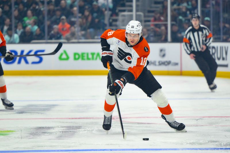Dec 28, 2025; Seattle, Washington, USA; Philadelphia Flyers center Rodrigo Abols (18) advances the puck against the Seattle Kraken during the first period at Climate Pledge Arena. Mandatory Credit: Steven Bisig-Imagn Images