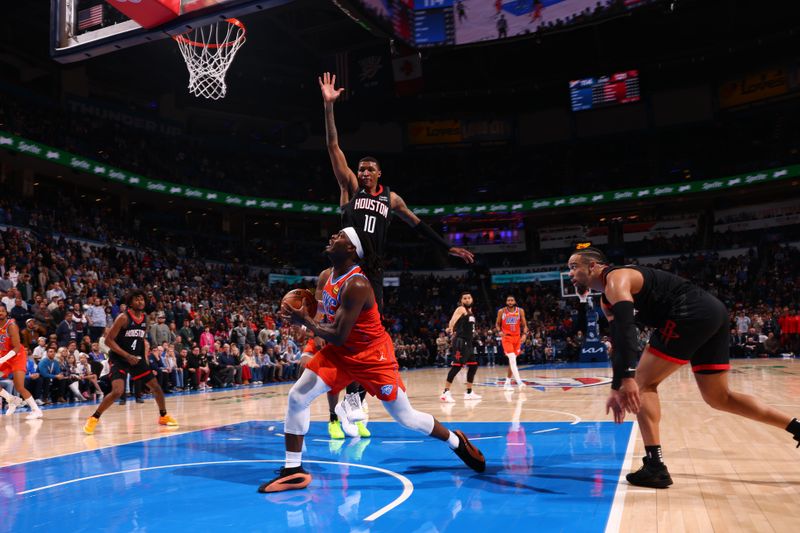 OKLAHOMA CITY, OK - MARCH 27:  Luguentz Dort #5 of the Oklahoma City Thunder drives to the basket during the game against the Houston Rockets on March 27, 2024 at Paycom Arena in Oklahoma City, Oklahoma. NOTE TO USER: User expressly acknowledges and agrees that, by downloading and or using this photograph, User is consenting to the terms and conditions of the Getty Images License Agreement. Mandatory Copyright Notice: Copyright 2024 NBAE (Photo by Zach Beeker/NBAE via Getty Images)