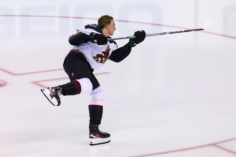 Oct 13, 2023; Newark, New Jersey, USA; Arizona Coyotes center Logan Cooley (92) takes his rookie lap before the start of his first NHL game against the New Jersey Devils at Prudential Center. Mandatory Credit: Ed Mulholland-USA TODAY Sports