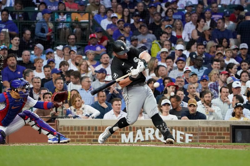 Jun 4, 2024; Chicago, Illinois, USA; Chicago White Sox first base Andrew Vaughn (25) hits a single against the Chicago Cubs during the fourth inning at Wrigley Field. Mandatory Credit: David Banks-USA TODAY Sports