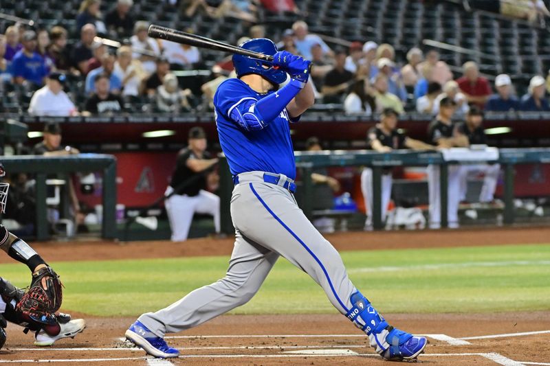 Apr 26, 2023; Phoenix, Arizona, USA; Kansas City Royals first baseman Vinnie Pasquantino (9) singles in the first inning against the Arizona Diamondbacks at Chase Field. Mandatory Credit: Matt Kartozian-USA TODAY Sports