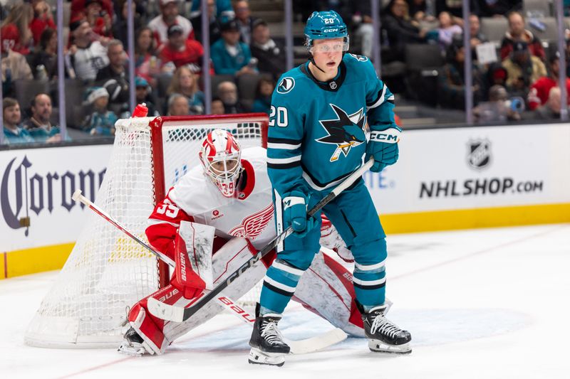 Nov 18, 2024; San Jose, California, USA; Detroit Red Wings goaltender Cam Talbot (39) looks around San Jose Sharks left wing Fabian Zetterlund (20) during the second period at SAP Center at San Jose. Mandatory Credit: Bob Kupbens-Imagn Images