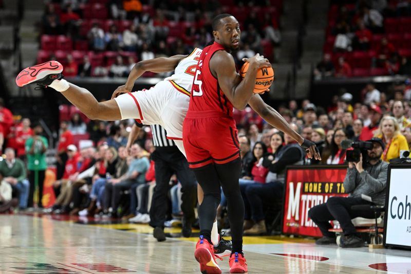 Feb 6, 2024; College Park, Maryland, USA; Rutgers Scarlet Knights forward Aundre Hyatt (5) spins away from Maryland Terrapins forward Jordan Geronimo (22) during the first half  at Xfinity Center. Mandatory Credit: Tommy Gilligan-USA TODAY Sports