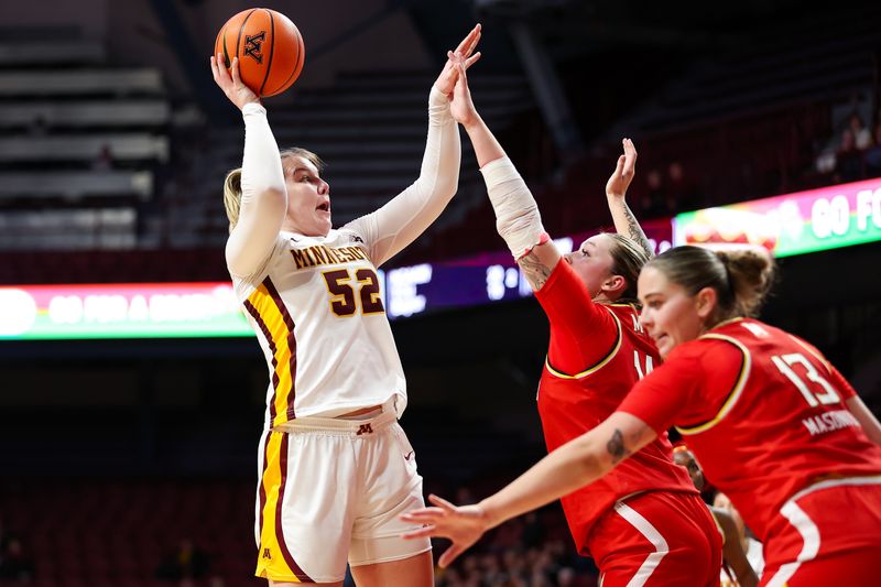 Jan 3, 2024; Minneapolis, Minnesota, USA; Minnesota Golden Gophers center Sophie Hart (52) shoots as Maryland Terrapins forward Allie Kubek (14) defends during the first half at Williams Arena. Mandatory Credit: Matt Krohn-USA TODAY Sports