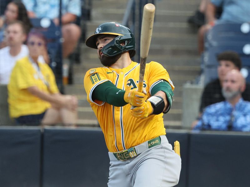 Jun 30, 2025; Tampa, Florida, USA;  Athletics catcher Shea Langeliers (23) hits a three-run home run against the Tampa Bay Rays during the first inning at George M. Steinbrenner Field. Mandatory Credit: Kim Klement Neitzel-Imagn Images