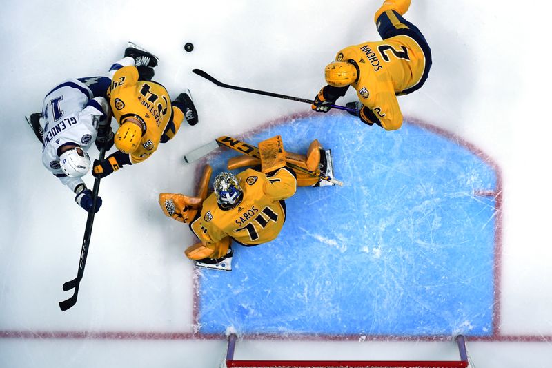 Dec 7, 2023; Nashville, Tennessee, USA; Nashville Predators goaltender Juuse Saros (74) makes a save during the first period against the Tampa Bay Lightning at Bridgestone Arena. Mandatory Credit: Christopher Hanewinckel-USA TODAY Sports