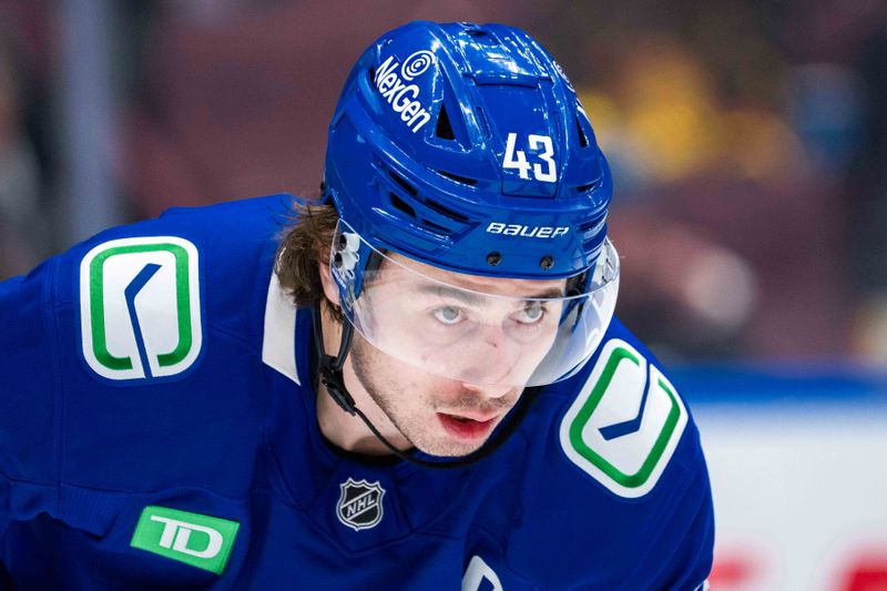 Jan 16, 2025; Vancouver, British Columbia, CAN; Vancouver Canucks defenseman Quinn Hughes (43) during a stop in play against the Los Angeles Kings in the third period at Rogers Arena. Mandatory Credit: Bob Frid-Imagn Images