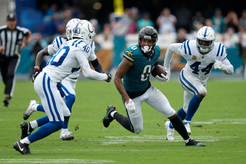 Jacksonville Jaguars wide receiver Gabe Davis (0) runs against Indianapolis Colts' Jaylon Jones (40) during the first half of an NFL football game, Sunday, Oct. 6, 2024, in Jacksonville, Fla. (AP Photo/John Raoux)