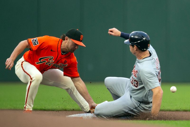 Aug 9, 2024; San Francisco, California, USA; San Francisco Giants second baseman Brett Wisely (0) cannot handle the throw from catcher as Detroit Tigers second baseman Colt Keith (33) steals second and then advances to third base on the throwing error during the first inning at Oracle Park. Mandatory Credit: D. Ross Cameron-USA TODAY Sports