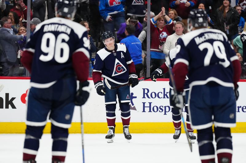 Mar 4, 2024; Denver, Colorado, USA; Colorado Avalanche defenseman Cale Makar (8) celebrates his goal scored with defenseman Devon Toews (7) in the second period against the Chicago Blackhawks at Ball Arena. Mandatory Credit: Ron Chenoy-USA TODAY Sports