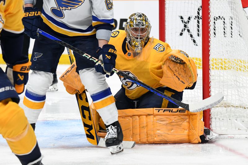 Apr 4, 2024; Nashville, Tennessee, USA; Nashville Predators goaltender Juuse Saros (74) watches the puck after a shot during the second period against the St. Louis Blues at Bridgestone Arena. Mandatory Credit: Christopher Hanewinckel-USA TODAY Sports