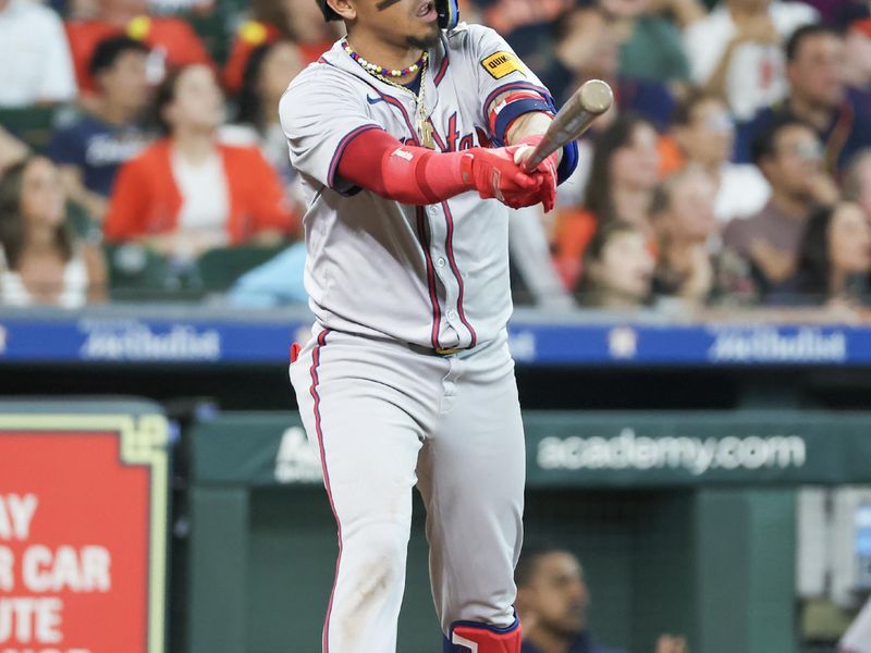 Apr 17, 2024; Houston, Texas, USA; Atlanta Braves shortstop Orlando Arcia (11) watches his RBI sacrifice against the Houston Astros in the eighth inning at Minute Maid Park. Mandatory Credit: Thomas Shea-USA TODAY Sports