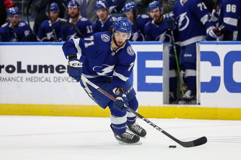 Jan 13, 2024; Tampa, Florida, USA;  Tampa Bay Lightning center Anthony Cirelli (71) controls the puck against the Anaheim Ducks in the third period at Amalie Arena. Mandatory Credit: Nathan Ray Seebeck-USA TODAY Sports