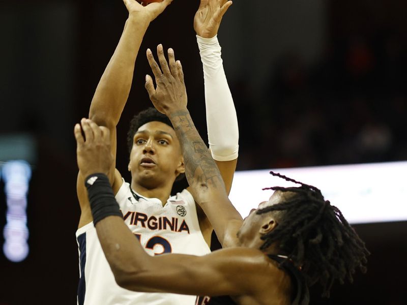 Mar 4, 2023; Charlottesville, Virginia, USA; Virginia Cavaliers guard Ryan Dunn (13) shoots the ball over Louisville Cardinals guard Mike James (1) in the second half at John Paul Jones Arena. Mandatory Credit: Geoff Burke-USA TODAY Sports