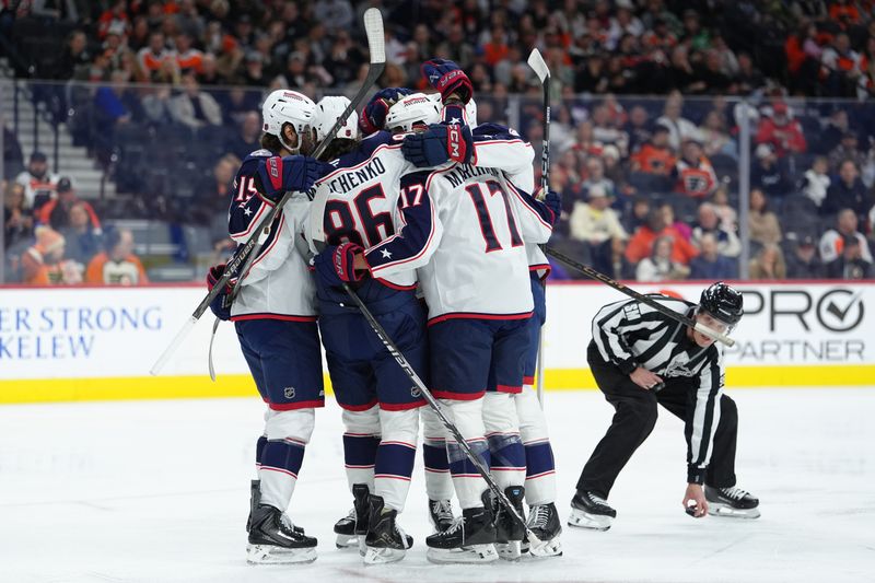 Mar 14, 2026; Philadelphia, Pennsylvania, USA; Columbus Blue Jackets right wing Kirill Marchenko (86) celebrates with teammates after scoring a goal against the Philadelphia Flyers in the first period at Xfinity Mobile Arena. Mandatory Credit: Kyle Ross-Imagn Images