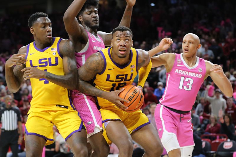 Jan 24, 2023; Fayetteville, Arkansas, USA; LSU Tigers forward KJ Williams (12) grabs a rebound under the goal as center Kendal Coleman (4) and Arkansas Razorbacks forward Makhi Mitchell (15) and guard Jordan Walsh (13) look on at Bud Walton Arena. Arkansas won 60-40. Mandatory Credit: Nelson Chenault-USA TODAY Sports