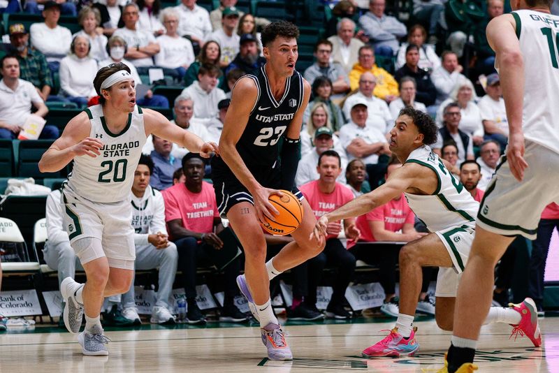 Feb 4, 2023; Fort Collins, Colorado, USA; Utah State Aggies forward Taylor Funk (23) controls the ball against Colorado State Rams guard Isaiah Rivera (23) and guard Joe Palmer (20) in the first half at Moby Arena. Mandatory Credit: Isaiah J. Downing-USA TODAY Sports