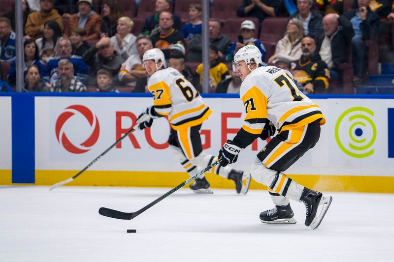 Oct 26, 2024; Vancouver, British Columbia, CAN; Pittsburgh Penguins forward Evgeni Malkin (71) handles the puck against the Vancouver Canucks during the third period at Rogers Arena. Mandatory Credit: Bob Frid-Imagn Images