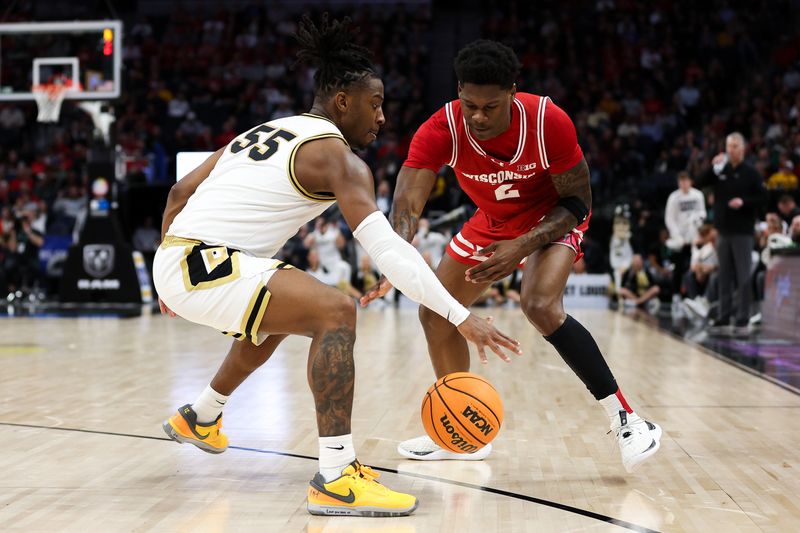 Mar 16, 2024; Minneapolis, MN, USA; Wisconsin Badgers guard AJ Storr (2) and Purdue Boilermakers guard Lance Jones (55) compete for the ball during the second half at Target Center. Mandatory Credit: Matt Krohn-USA TODAY Sports