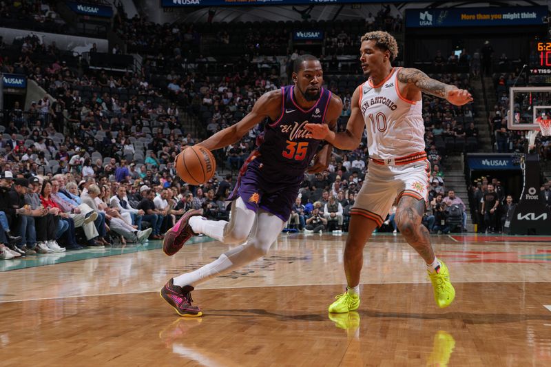 SAN ANTONIO, TX - MARCH 25: Kevin Durant #35 of the Phoenix Suns dribbles the ball during the game against the San Antonio Spurs on March 25, 2024 at the AT&T Center in San Antonio, Texas. NOTE TO USER: User expressly acknowledges and agrees that, by downloading and or using this photograph, user is consenting to the terms and conditions of the Getty Images License Agreement. Mandatory Copyright Notice: Copyright 2024 NBAE (Photos by Jesse D. Garrabrant/NBAE via Getty Images)