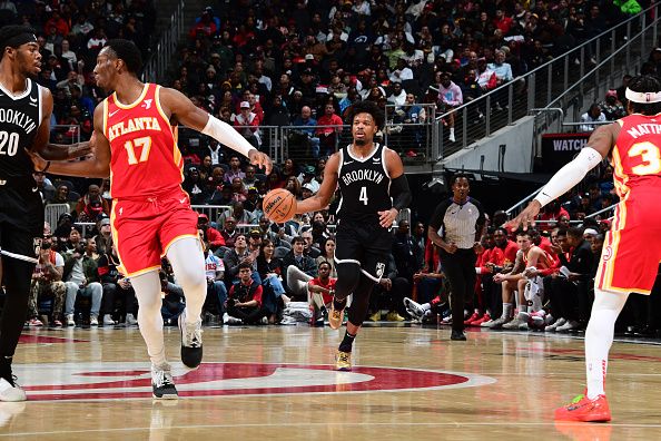 ATLANTA, GA - DECEMBER 6: Dennis Smith Jr. #4 of the Brooklyn Nets dribbles the ball during the game against the Atlanta Hawks on December 6, 2023 at State Farm Arena in Atlanta, Georgia.  NOTE TO USER: User expressly acknowledges and agrees that, by downloading and/or using this Photograph, user is consenting to the terms and conditions of the Getty Images License Agreement. Mandatory Copyright Notice: Copyright 2023 NBAE (Photo by Scott Cunningham/NBAE via Getty Images)