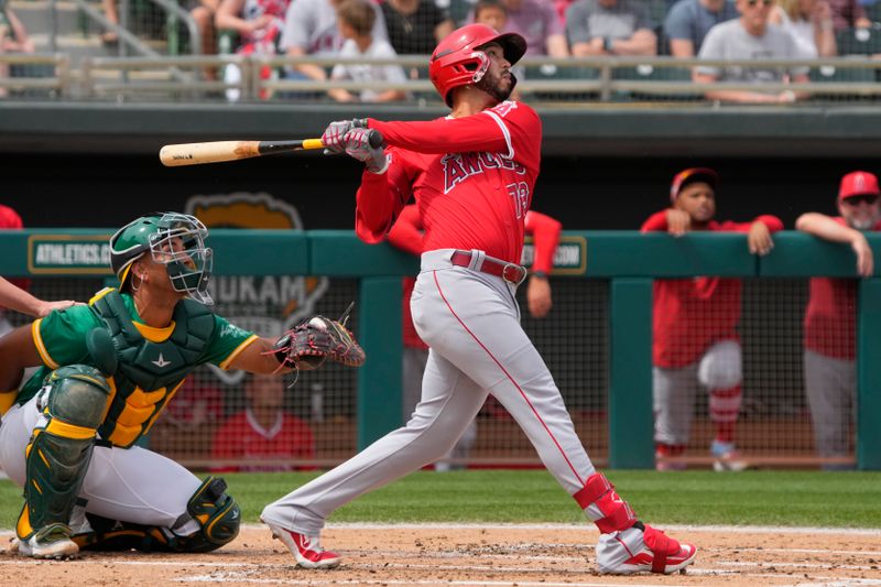 Mar 23, 2024; Mesa, Arizona, USA; Los Angeles Angels second baseman Livan Soto (73) hits against the Oakland Athletics  in the second inning at Hohokam Stadium. Mandatory Credit: Rick Scuteri-USA TODAY Sports