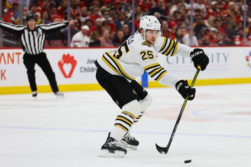 May 6, 2024; Sunrise, Florida, USA; Boston Bruins defenseman Brandon Carlo (25) moves the puck against the Florida Panthers during the first period in game one of the second round of the 2024 Stanley Cup Playoffs at Amerant Bank Arena. Mandatory Credit: Sam Navarro-USA TODAY Sports