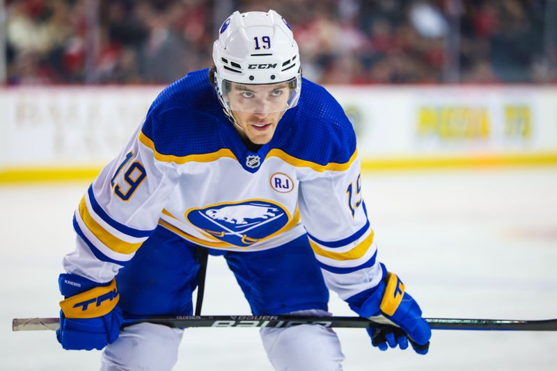 Mar 24, 2024; Calgary, Alberta, CAN; Buffalo Sabres center Peyton Krebs (19) during the face off against the Calgary Flames during the first period at Scotiabank Saddledome. Mandatory Credit: Sergei Belski-USA TODAY Sports