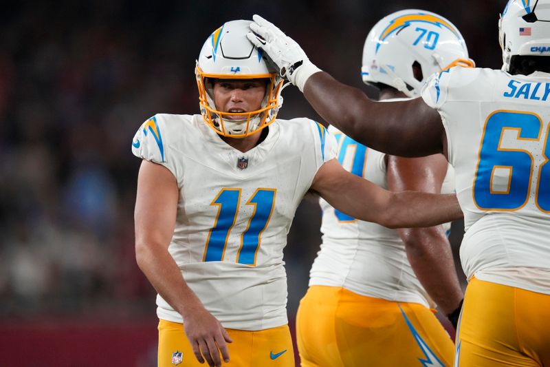 Los Angeles Chargers place kicker Cameron Dicker (11) celebrates after kicking a field goal during the second half of an NFL football game against the Arizona Cardinals, Monday, Oct. 21, 2024, in Glendale Ariz. (AP Photo/Matt York)