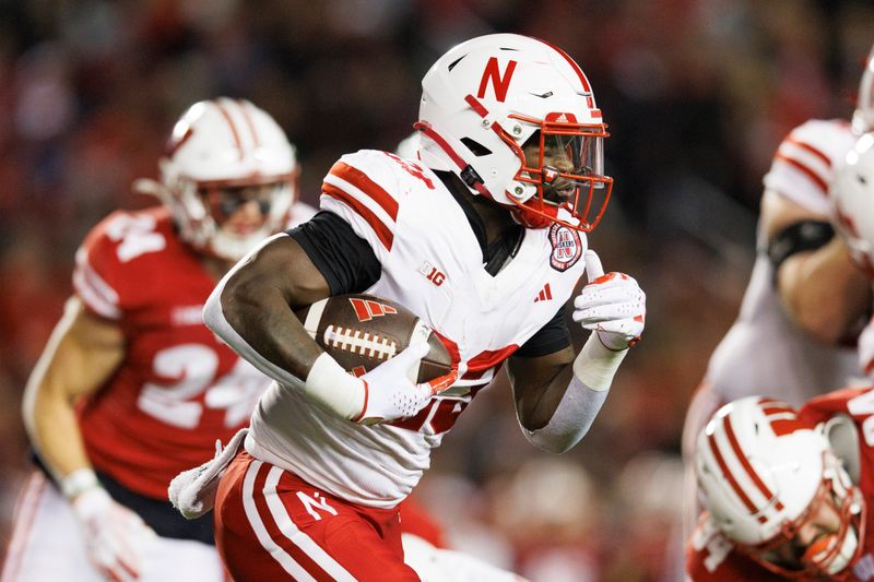 Nov 18, 2023; Madison, Wisconsin, USA;  Nebraska Cornhuskers running back Anthony Grant (23) rushes with the football during the first quarter against the Wisconsin Badgers at Camp Randall Stadium. Mandatory Credit: Jeff Hanisch-USA TODAY Sports