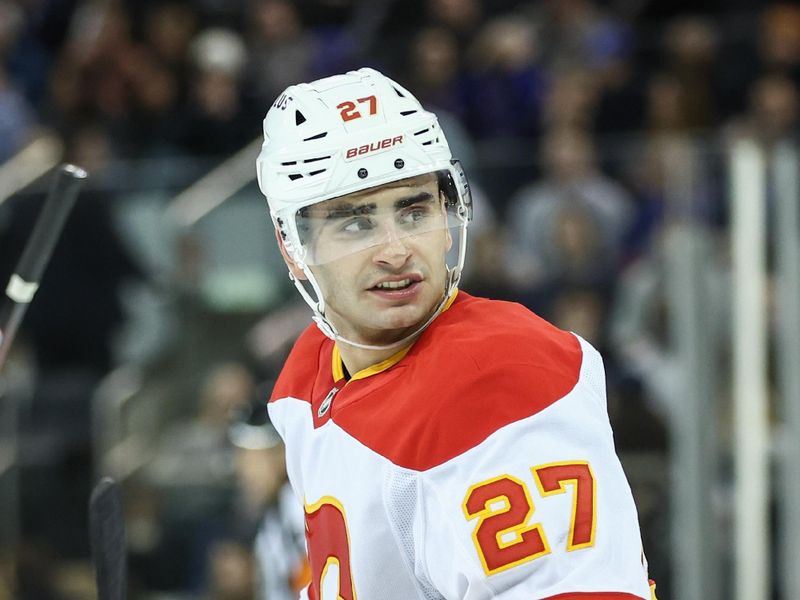 Mar 18, 2025; New York, New York, USA;  Calgary Flames right wing Matt Coronato (27) skates back to center ice after scoring a goal in the first period against the New York Rangers at Madison Square Garden. Mandatory Credit: Wendell Cruz-Imagn Images