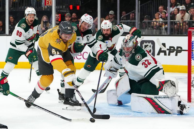 Apr 29, 2025; Las Vegas, Nevada, USA; Minnesota Wild defenseman Jared Spurgeon (46) stick checks Vegas Golden Knights right wing Mark Stone (61) in front of Minnesota Wild goaltender Filip Gustavsson (32) during the second period of game five of the first round of the 2025 Stanley Cup Playoffs at T-Mobile Arena. Mandatory Credit: Stephen R. Sylvanie-Imagn Images