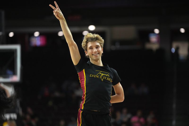 Dec 4, 2024; Los Angeles, California, USA; Southern California Trojans dance force team cheerleader Hugo Miller performs during a game against the Oregon Ducks at Galen Center. Mandatory Credit: Kirby Lee-Imagn ImagesDec 4, 2024; Los Angeles, California, USA; at Galen Center. Mandatory Credit: Kirby Lee-Imagn Images