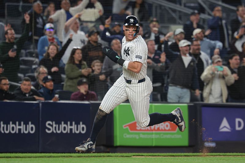 May 3, 2024; Bronx, New York, USA; New York Yankees center fielder Aaron Judge (99) scores a run during the ninth inning against the Detroit Tigers at Yankee Stadium. Mandatory Credit: Vincent Carchietta-USA TODAY Sports