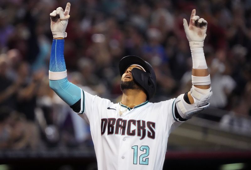 Jun 29, 2023; Phoenix, Arizona, USA; Arizona Diamondbacks left fielder Lourdes Gurriel Jr. (12) celebrates his solo home run against the Tampa Bay Rays at Chase Field. Mandatory Credit: Joe Rondone-USA TODAY Sports