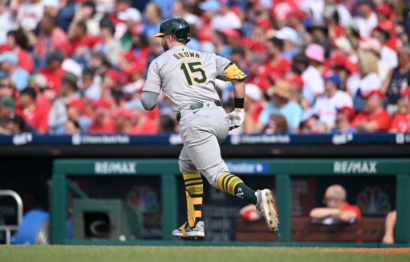 Jul 13, 2024; Philadelphia, Pennsylvania, USA; Oakland Athletics first baseman Seth Brown (15) runs to first after hitting an RBI double against the Philadelphia Phillies in the second inning at Citizens Bank Park. Mandatory Credit: Kyle Ross-USA TODAY Sports