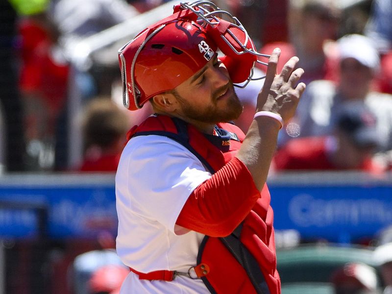 May 7, 2025; St. Louis, Missouri, USA;  St. Louis Cardinals catcher Pedro Pages (43) adjusts his mask after he was hit with a foul ball during the sixth inning against the Pittsburgh Pirates at Busch Stadium. Mandatory Credit: Jeff Curry-Imagn Images