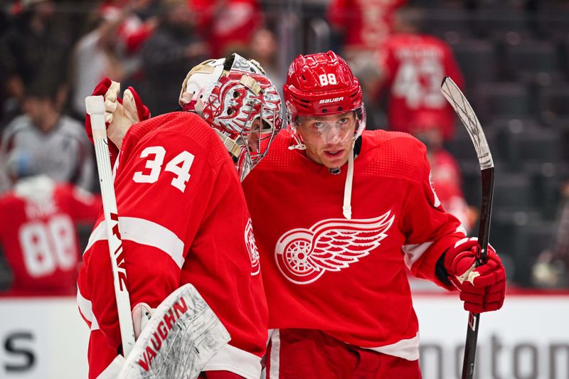 Feb 27, 2024; Detroit, Michigan, USA; Detroit Red Wings goaltender Alex Lyon (34) and right wing Patrick Kane (88) after the game against the Washington Capitals at Little Caesars Arena. Mandatory Credit: Tim Fuller-USA TODAY Sports