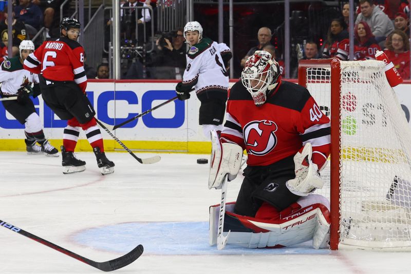 Oct 13, 2023; Newark, New Jersey, USA; New Jersey Devils goaltender Akira Schmid (40) makes a save against the Arizona Coyotes during the third period at Prudential Center. Mandatory Credit: Ed Mulholland-USA TODAY Sports