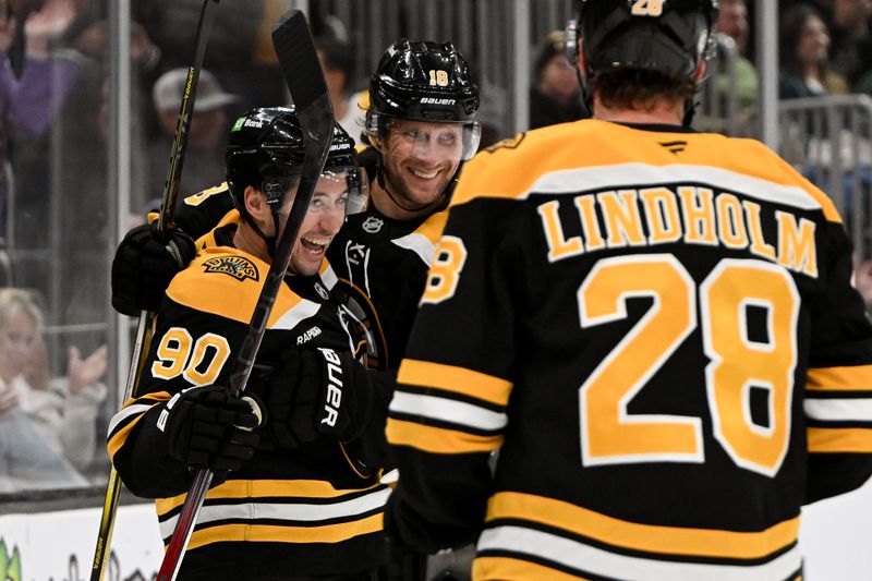 Oct 1, 2024; Boston, Massachusetts, USA; Boston Bruins forward Tyler Johnson celebrates with center Pavel Zacha (18) and center Elias Lindholm (28) after scoring a goal against the Philadelphia Flyers during the third period at the TD Garden. Mandatory Credit: Brian Fluharty-Imagn Images