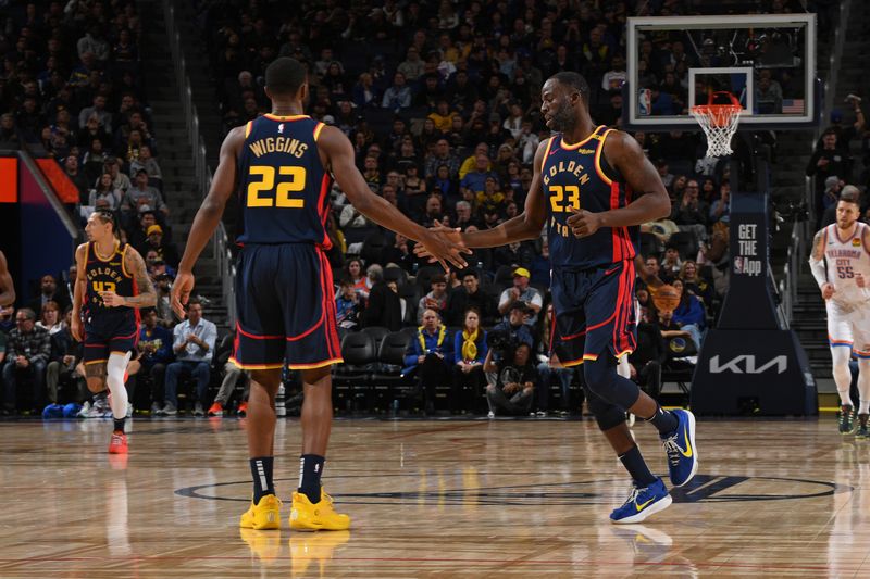 SAN FRANCISCO, CA - NOVEMBER 27: Andrew Wiggins #22 and Draymond Green #23 of the Golden State Warriors high five during the game against the Oklahoma City Thunder on November 27, 2024 at Chase Center in San Francisco, California. NOTE TO USER: User expressly acknowledges and agrees that, by downloading and or using this photograph, user is consenting to the terms and conditions of Getty Images License Agreement. Mandatory Copyright Notice: Copyright 2024 NBAE (Photo by Noah Graham/NBAE via Getty Images)