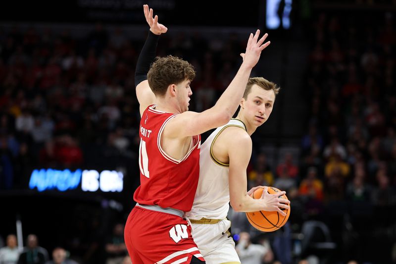 Mar 16, 2024; Minneapolis, MN, USA; Purdue Boilermakers guard Fletcher Loyer (2) controls the ball as Wisconsin Badgers guard Max Klesmit (11) defends during the first half at Target Center. Mandatory Credit: Matt Krohn-USA TODAY Sports