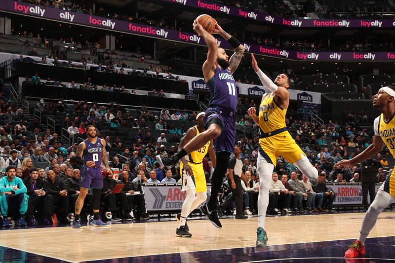 CHARLOTTE, NC - February 12: Cody Martin #11 of the Charlotte Hornets handles the ball during the game against the Indiana Pacers on February 12, 2024 at Spectrum Center in Charlotte, North Carolina. NOTE TO USER: User expressly acknowledges and agrees that, by downloading and or using this photograph, User is consenting to the terms and conditions of the Getty Images License Agreement. Mandatory Copyright Notice: Copyright 2024 NBAE (Photo by Kent Smith/NBAE via Getty Images)