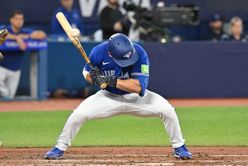 Aug 26, 2023; Toronto, Ontario, CAN;  Toronto Blue Jays second baseman Davis Schneider (36) ducks under a high pitch from Cleveland Guardians pitcher Cody Morris (not shown) in the fifth inning at Rogers Centre. Mandatory Credit: Dan Hamilton-USA TODAY Sports