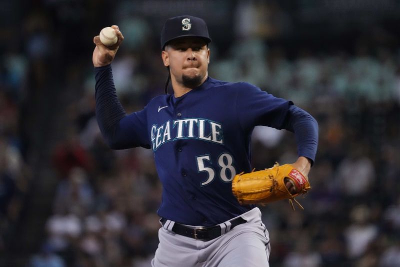 Jul 30, 2023; Phoenix, Arizona, USA; Seattle Mariners starting pitcher Luis Castillo (58) pitches against the Arizona Diamondbacks during the first inning at Chase Field. Mandatory Credit: Joe Camporeale-USA TODAY Sports