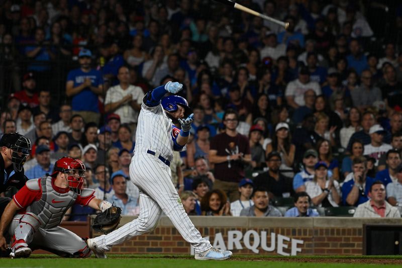 Jun 29, 2023; Chicago, Illinois, USA;  Chicago Cubs left fielder Ian Happ (8) loses his bat after striking out against the Philadelphia Phillies during the seventh inning at Wrigley Field. Mandatory Credit: Matt Marton-USA TODAY Sports