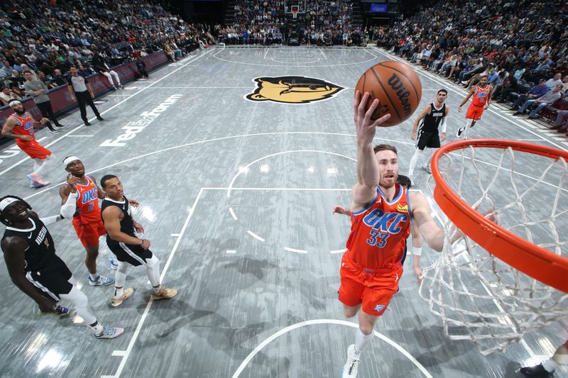 MEMPHIS, TN - MARCH 16:  Gordon Hayward #33 of the Oklahoma City Thunder drives to the basket during the game against the Memphis Grizzlies on March 16, 2024 at FedExForum in Memphis, Tennessee. NOTE TO USER: User expressly acknowledges and agrees that, by downloading and or using this photograph, User is consenting to the terms and conditions of the Getty Images License Agreement. Mandatory Copyright Notice: Copyright 2024 NBAE (Photo by Joe Murphy/NBAE via Getty Images)