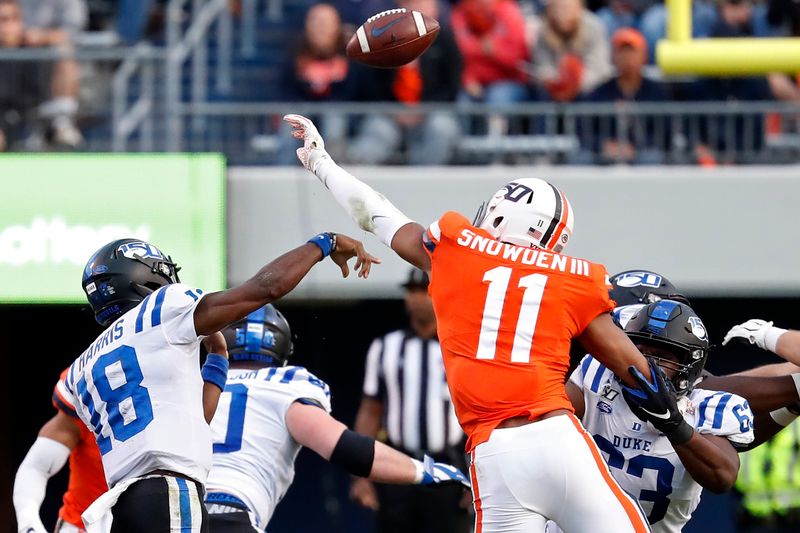 Oct 19, 2019; Charlottesville, VA, USA; Virginia Cavaliers linebacker Charles Snowden (11) deflects a pass by Duke Blue Devils quarterback Quentin Harris (18) in the third quarter at Scott Stadium. Mandatory Credit: Geoff Burke-USA TODAY Sports