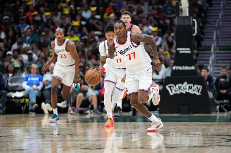 SEATTLE, WA - OCTOBER 11: Kevin Porter Jr. #77 of the LA Clippers dribbles the ball during the game against the Portland Trail Blazers during a NBA Preseason game on October 11, 2024 at the Climate Pledge Arena in Seattle, Washington. NOTE TO USER: User expressly acknowledges and agrees that, by downloading and or using this photograph, user is consenting to the terms and conditions of the Getty Images License Agreement. Mandatory Copyright Notice: Copyright 2024 NBAE (Photo by Liv Lyons/NBAE via Getty Images)